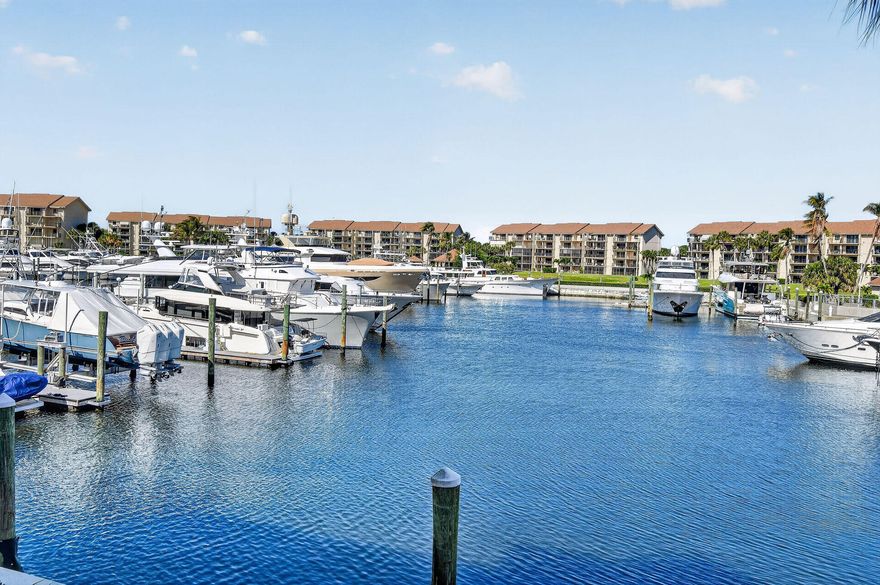 Enjoy spectacular marina views from your living room, kitchen, primary suite, and covered balconies. This beautiful end unit features a spacious layout with a large living area, dining space, and versatile bonus/laundry room ideal for storage, an office, or guests. The updated kitchen includes stainless steel appliances, while renovated bath vanities and a newer water heater add value and comfort. Residents enjoy four resort-style pools with tropical breezes, covered pavilions and serene water views, plus tennis, pickleball, and bocce courts. Lush landscaping and winding sidewalks are perfect for walking or biking. The Bluffs offers beach access and is minutes from Jupiter beaches, Juno Pier, Harbourside, dining, theaters, and nightlife.