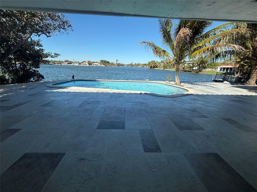 Beautifully updated waterfront residence located in the gated community of Highland Lakes in Aventura. This spacious family home features impact windows and doors, renovated custom bathrooms, and a high-end kitchen with custom cabinetry and premium appliances.Open living areas provide great natural light and seamless flow to the backyard, ideal for entertaining. Enjoy lake views from the private pool area, covered patio, and garden space.Highland Lakes offers a private park and playground, and an elementary school conveniently located within the community. Prime location close to Aventura Mall, houses of worship, major highways, and the beaches.A wonderful opportunity to enjoy comfortable waterfront living in one of Aventura’s most desirable neighborhoods.