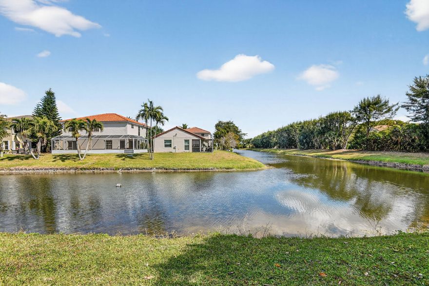 Enjoy direct access to Wellington's scenic canal system with connection to Central Wellington's lake, perfect for electric motor boating, paddle sports, and catch-and-release fishing. This 2-story 3BD/2.5BA home offers 2,108 sq ft under air and is ideally positioned on the canal with desirable eastern rear exposure. A screened patio and fenced yard provide a private setting to relax and enjoy the morning sun. Inside, the bright and inviting layout is designed for comfortable everyday living. Located in a sought-after community with low HOA and no rental restrictions, plus access to a lakefront pool, dock, and picnic area. Just minutes from top-rated schools, parks, shopping, dining, equestrian venues, the Wellington Amphitheater, and the Aquatics Complex.