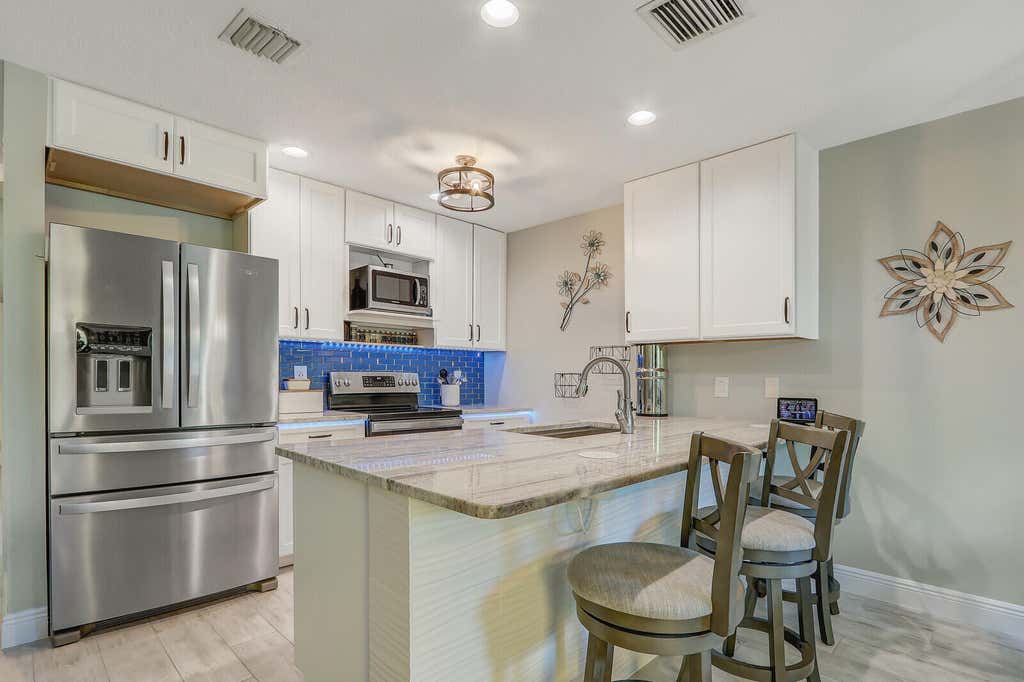 Photo of 12812 Woodmill Drive, Palm Beach Gardens, FL 33418 (MLS # R11018972)