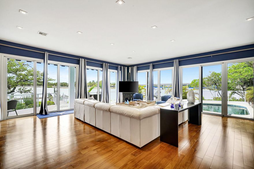 Welcome to the pinnacle of coastal living at Jupiter Harbour, where this 3,500+ square foot townhome redefines luxury and convenience. Elevate your lifestyle with a private elevator, ensuring seamless access to every level of this meticulously designed residence. The panoramic views of the Intercoastal waterway through hurricane impact windows add an element of awe to your daily living.

Imagine waking up to the serene beauty of the Intercoastal, just a short 5-minute walk from the pristine sands of the ocean. This residence not only embraces the natural beauty of its surroundings but also provides a secure haven with hurricane impact windows, ensuring your peace of mind and protection against the elements.

For those with a passion for boating, a brand new 24,000-pound boat lift awaits, promising effortless access to the open waters for your vessel. The heated pool invites you to indulge in year-round relaxation and entertainment, while the newly constructed dock and fenced patio create the perfect setting for private moments by the water.

Discover the convenience of being within walking distance to Jupiter's finest restaurants and shopping centers, allowing you to immerse yourself in the vibrant local culture. The 24-hour gated community ensures security and peace of mind, allowing you to enjoy the exclusive amenities and the natural beauty that surrounds you.

As a resident of Jupiter Harbour, you not only have access to your private oasis but also to the community pool and tennis courts, fostering a sense of community and leisure. Positioned on the point lot of Jupiter Harbour, this townhome offers unparalleled exclusivity and privacy.

In summary, this townhome at Jupiter Harbour encapsulates the epitome of elegant, carefree coastal living. With its luxurious features, breathtaking views, and proximity to all that Jupiter has to offer, this residence presents an unparalleled opportunity to embrace a lifestyle that seamlessly blends luxury, convenience, and natural beauty. Welcome home to the waterfront haven you've always dreamed of.