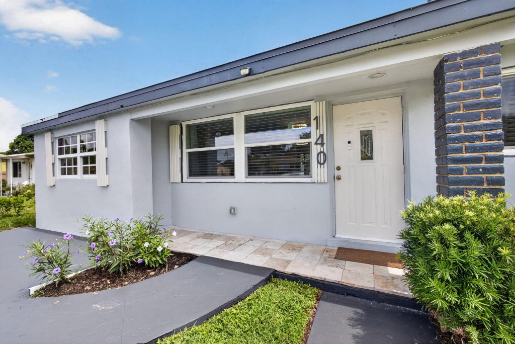 Photo of 140 W 31st Court, Riviera Beach, FL 33404 (MLS # B26054669)