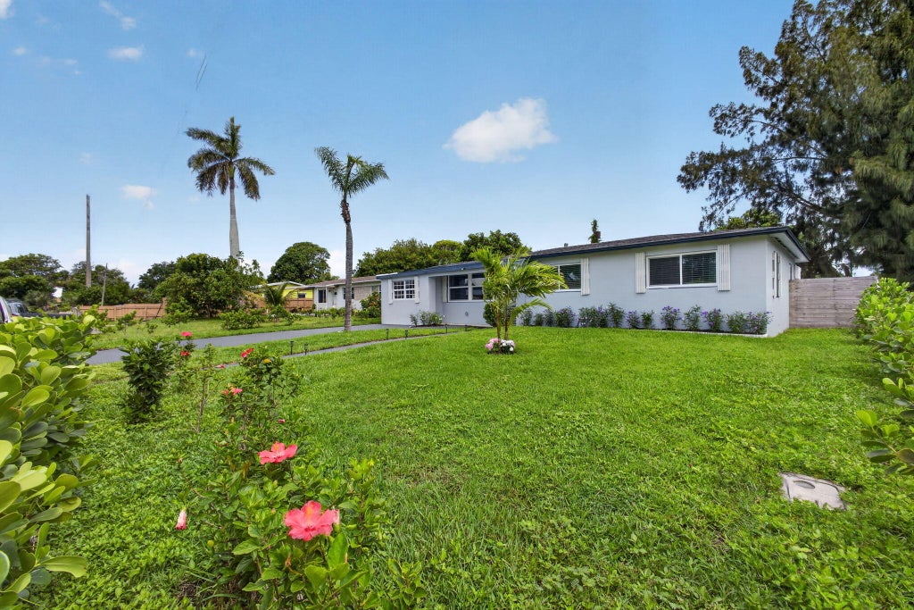 Photo of 140 W 31st Court, Riviera Beach, FL 33404 (MLS # B26054669)