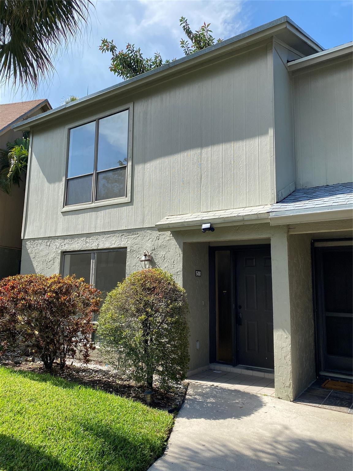Location, location, Location. This cozy villa offers 4 beds and 3 full baths with 1 bedroom downstairs. New renovated kitchen features solid wood cabinet, quartz countertop, SS appliances, pull-out faucet, and deep square sink. Wash/dryer inside the unit. The balcony outside of the master has a water view and is perfect for outdoor relaxation. Utility sinks in the rear yard are convenient for extra cleanings. Spacious fenced rear yard w. paver is great for BBQ and family gatherings. 2 parking spots: 1 Assigned and 1 unassigned parking. It is close to the Tanger Outlets, The Gardens Mall, the beaches, shopping plazas! HOA fee is only about $128 per month, which includes lawn care, exterior pest control, management, and reserve. No HOA approval required for purchasing or leasing.