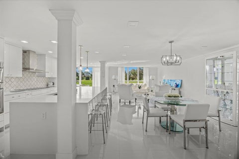 Photo of 5390 WOODLAND LAKES Drive #105, Palm Beach Gardens, FL 33418 (MLS # B26083478)