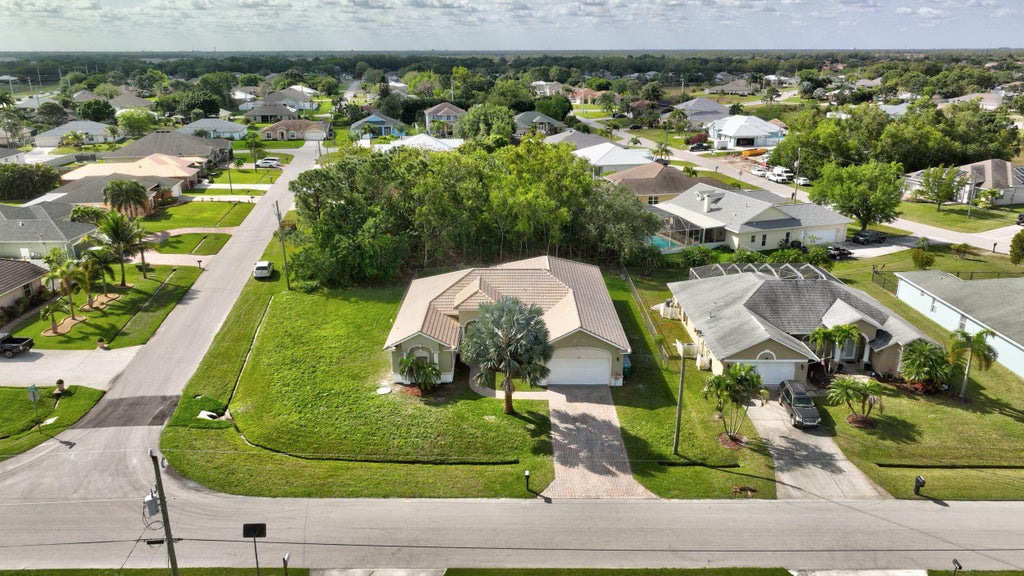 Photo of 6470 NW Regal Circle, Port Saint Lucie, FL 34983 (MLS # R10968477)