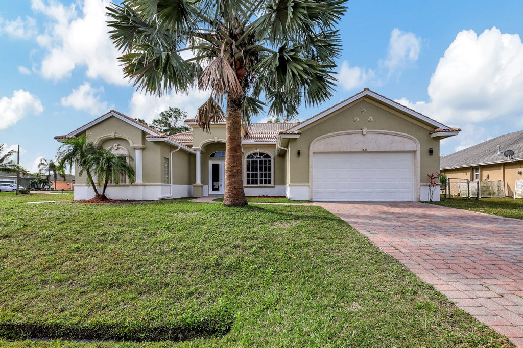 Photo of 6470 NW Regal Circle, Port Saint Lucie, FL 34983 (MLS # R10968477)