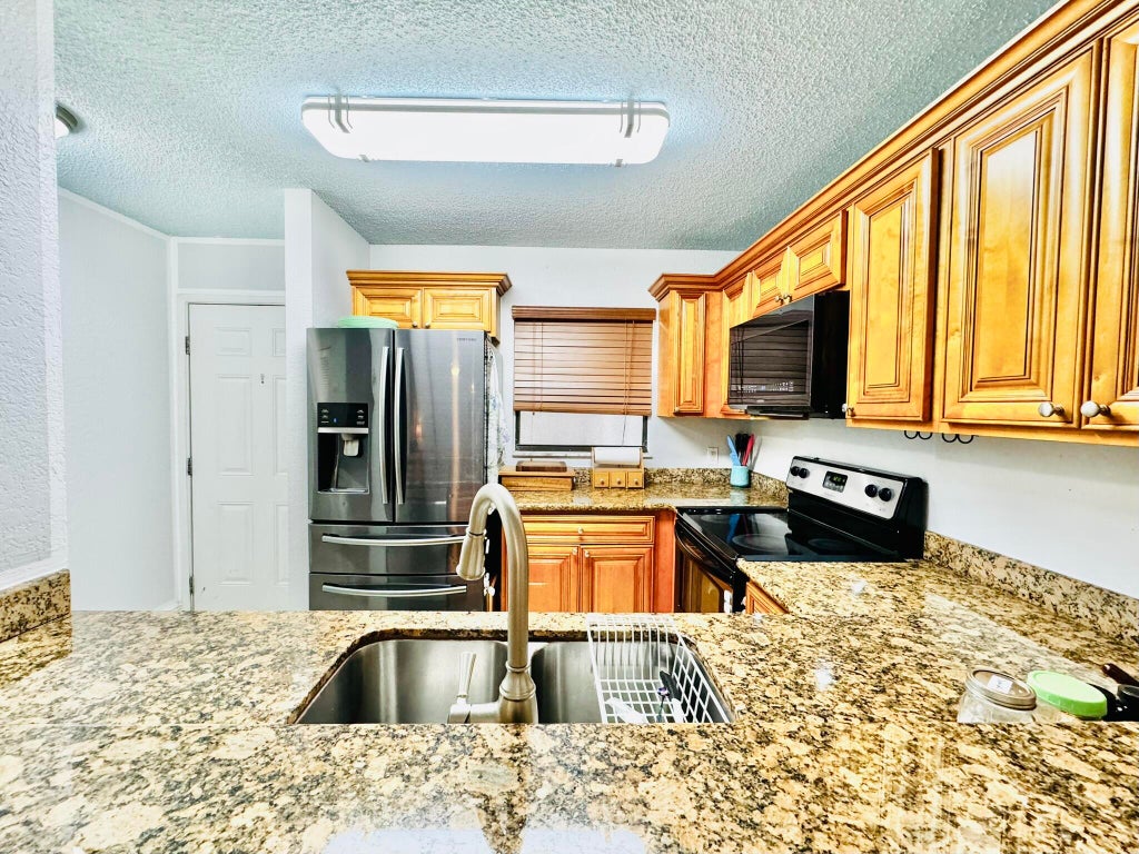 Photo of 1541 BALFOUR POINT Drive #D, West Palm Beach, FL 33411 (MLS # B26065971)