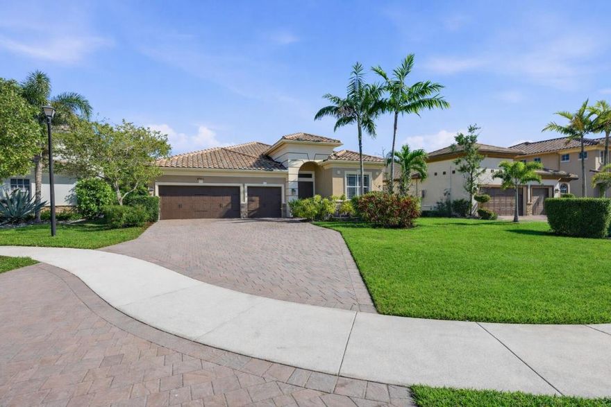 Tucked away on a cul-de-sac near the gate in  this 5-bedroom, 4-bath home built in 2017 sits on a pie-shaped lot one of the largest in the subdivision with a fully fenced yard and room for a pool. French front doors open to a cathedral-style foyer with 12-foot ceilings and a triple-split, open floor plan. The kitchen features a gas stove, double oven, tankless gas water heater, and gas dryer. The layout includes two primary suites, a Jack-and-Jill design, and two bedrooms with built-in marble workspaces, while the main primary suite offers two walk-in closets. Additional highlights include a 2017 roof, hurricane impact protection, gas-operated whole-house generator, epoxy-finished garage, and recently painted and pressure-washed exterior (1/26). In gated prestigious community of MiraLago