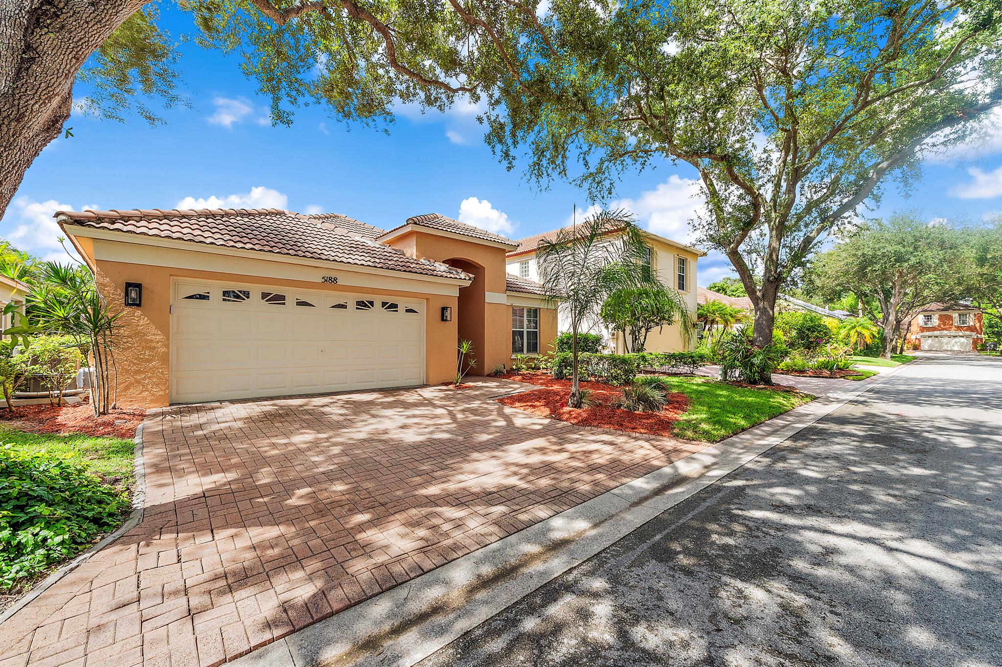 Completely remodeled ranch-style home located on a quiet dead-end street in one of the area's most desirable gated communities. Step inside to an open-concept layout featuring vaulted ceilings, and a bright white kitchen with quartz countertops and 2023 Smart Samsung appliances. The split bedroom floor plan provides privacy, with a remodeled master suite and spa-like bath on one side and guest bedrooms on the other. Both guest bedrooms are spacious, one includes a gorgeous custom/modern-farmhouse murphy bed! The 2024 all-in-one washer and dryer is conveniently located in the interior utility room.