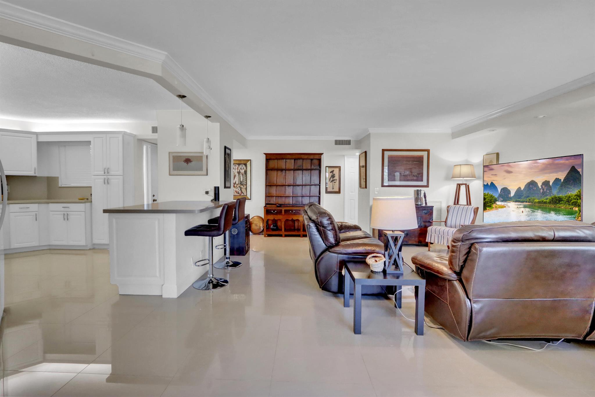 Bright and spacious 2-bedroom, 2-bathroom condo in a 24-hour man-gated, all-ages community. This unit features a beautifully renovated kitchen with quartz countertops and newer appliances. Enjoy the canal view and lush greenery from the spacious patio. Washer/dryer conveniently located inside the unit. Rent includes water, basic cable, and HBO Max. A minimum credit score of 700 is required. Top-rated schools include Verde, Boca Middle, and Boca High School. Conveniently located near restaurants, Town Center Mall, stunning beaches, Mizner Park, FAU, Lynn University and I-95