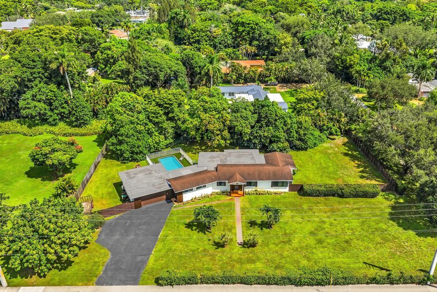 THIS HOME HAS IT ALL!!! HUGE CORNER LOT ALMOST AN ACRE FULLY REMODELED IMPACT WINDOWS & DOORS, NEW KITCHEN W/STAINLESS APPLIANCE , 4 FULL BEDROOMS 3 BATHROOMS ,BIG GARAGE, VERY LARGE MASTERS SUITS + SEPARATE BONUS ROOM CAN BE USEDAS 5TH BEDROOM . THE KITCHEN OPENS TO THE LIVING ROOM . AN OVERSIZED YARD, LARGE POOL AND HOTTUB , IT'S THE PERFECT HOME FOR ENTERTAINING! UPDATED ELECTRICAL, AND NEWER AC SYSTEM. THIS AREA IS CLOSE TO HIGHWAYS, AIRPORT, BEACHES, VERY CONVENIENT LOCATION. CAN BE USED AS AN AIRBNB .COME CHECK IT OUT BEFORE IT'S GONE!