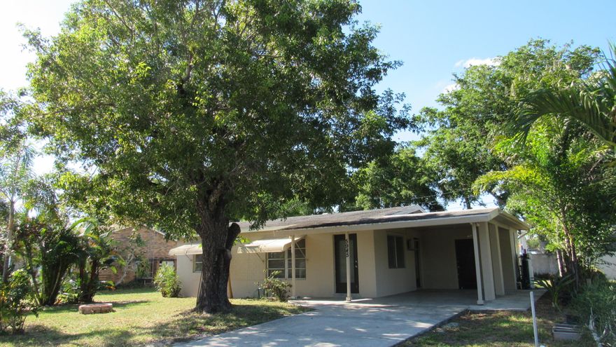 Great starter home or investment property!  This 2/1 single family home with carport is located just outside the walls of the City of Atlantis. Kitchen and Bathroom have just been updated! New laminate floors in living room and bedrooms, tile floors in kitchen and bathroom.  New Central A/C!  New Frigidaire smoothtop range and refrigerator.  11' X 7' laundry/utility room with workbench has New GE washer & dryer.  Very quiet street in unincorporated Palm Beach County subdivision of Arcanum, close to shopping and other conveniences.  Newer septic tank and well pump.