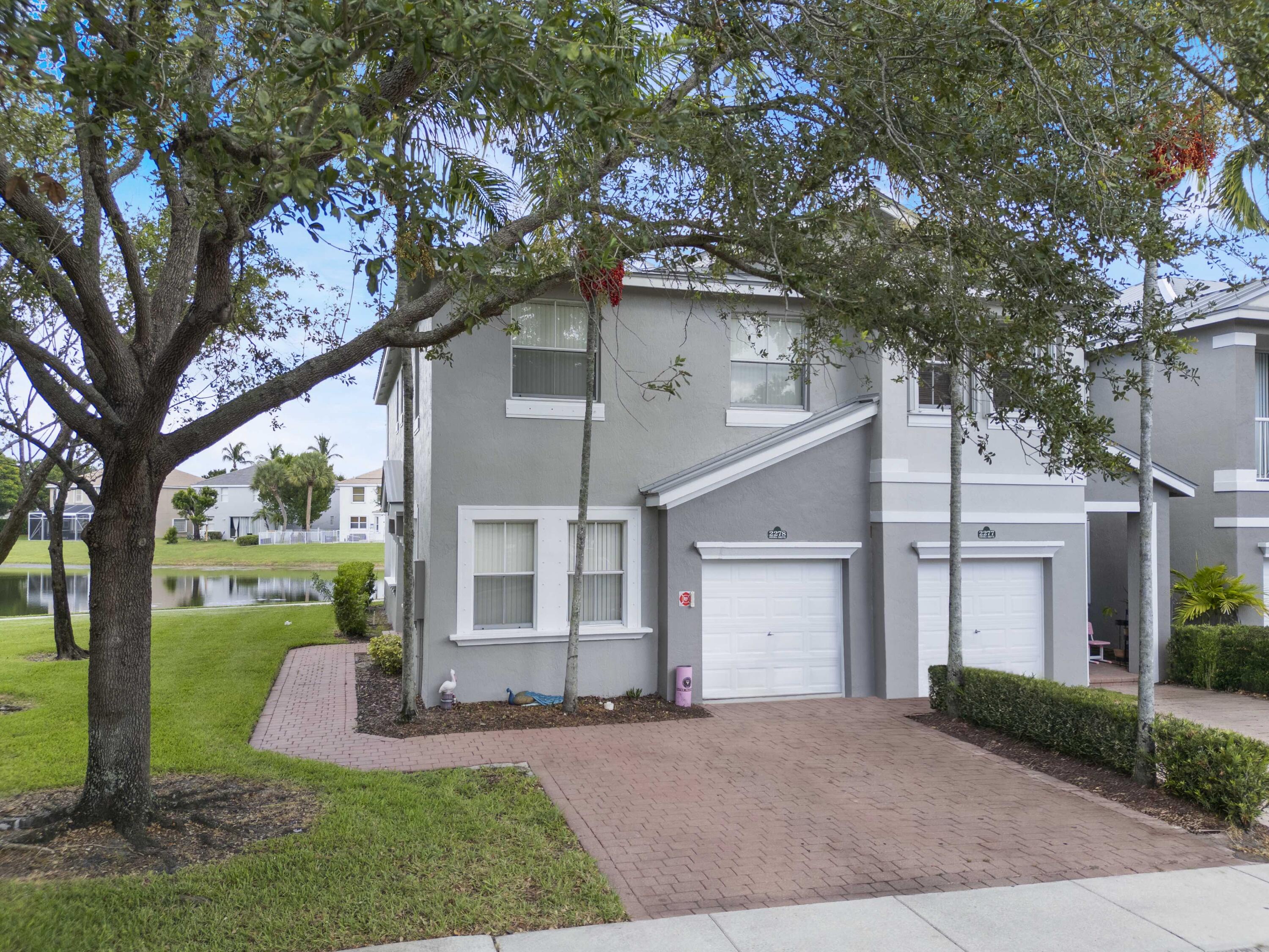 Spacious 4 Bed, 3 Bath Townhouse with Lake View in the Desirable Shoma Home! This two-story end-unit offers added privacy with nothing front of the door and beautiful lake views. The home features one bedroom and a full bath on the first floor with a dining area, and family room. Upstairs, have three additional bedrooms and a convenient laundry room. The master suite includes a double-door entry, walk-in closet, sitting area, bathroom with dual sinks and a Roman tub. One-car garage included. Tenant Occupied -- Do Not Disturb Tenant. Great investment opportunity -- seller has another property in the same community.