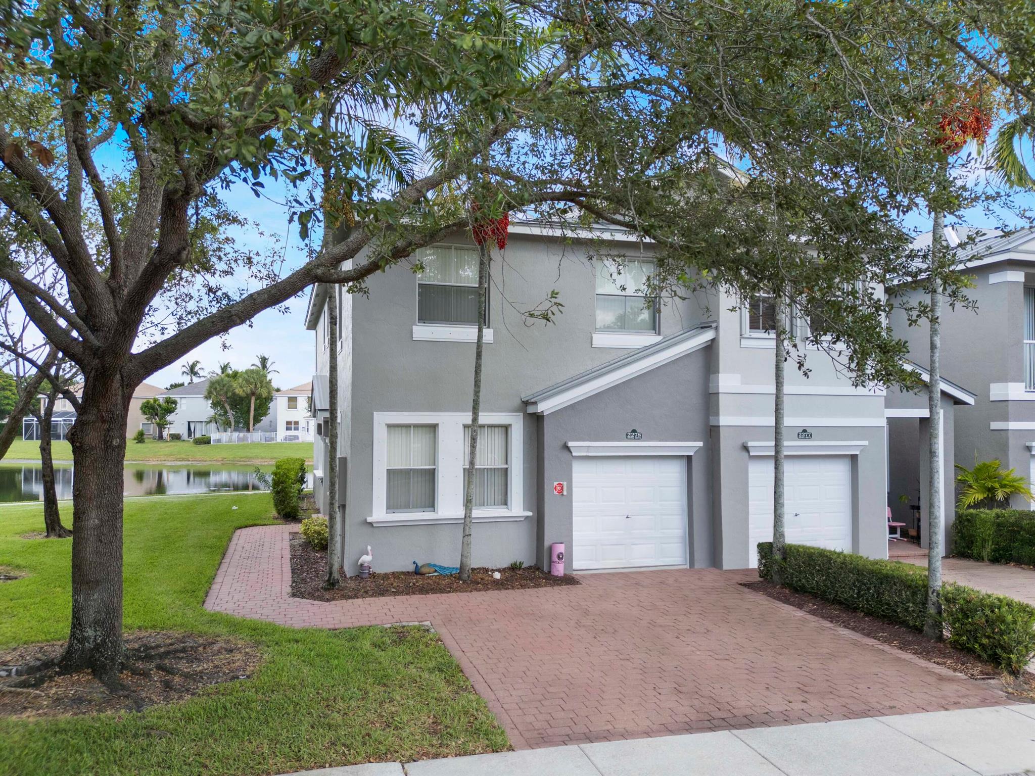 Spacious 4 Bed, 3 Bath Townhouse with Lake View in the Desirable Shoma Home! This two-story end-unit offers added privacy with nothing front of the door and beautiful lake views. The home features one bedroom and a full bath on the first floor with a dining area, and family room. Upstairs, have three additional bedrooms and a convenient laundry room. The master suite includes a double-door entry, walk-in closet, sitting area, bathroom with dual sinks and a Roman tub. One-car garage included. Tenant Occupied -- Do Not Disturb Tenant. Great investment opportunity -- seller has another property in the same community.