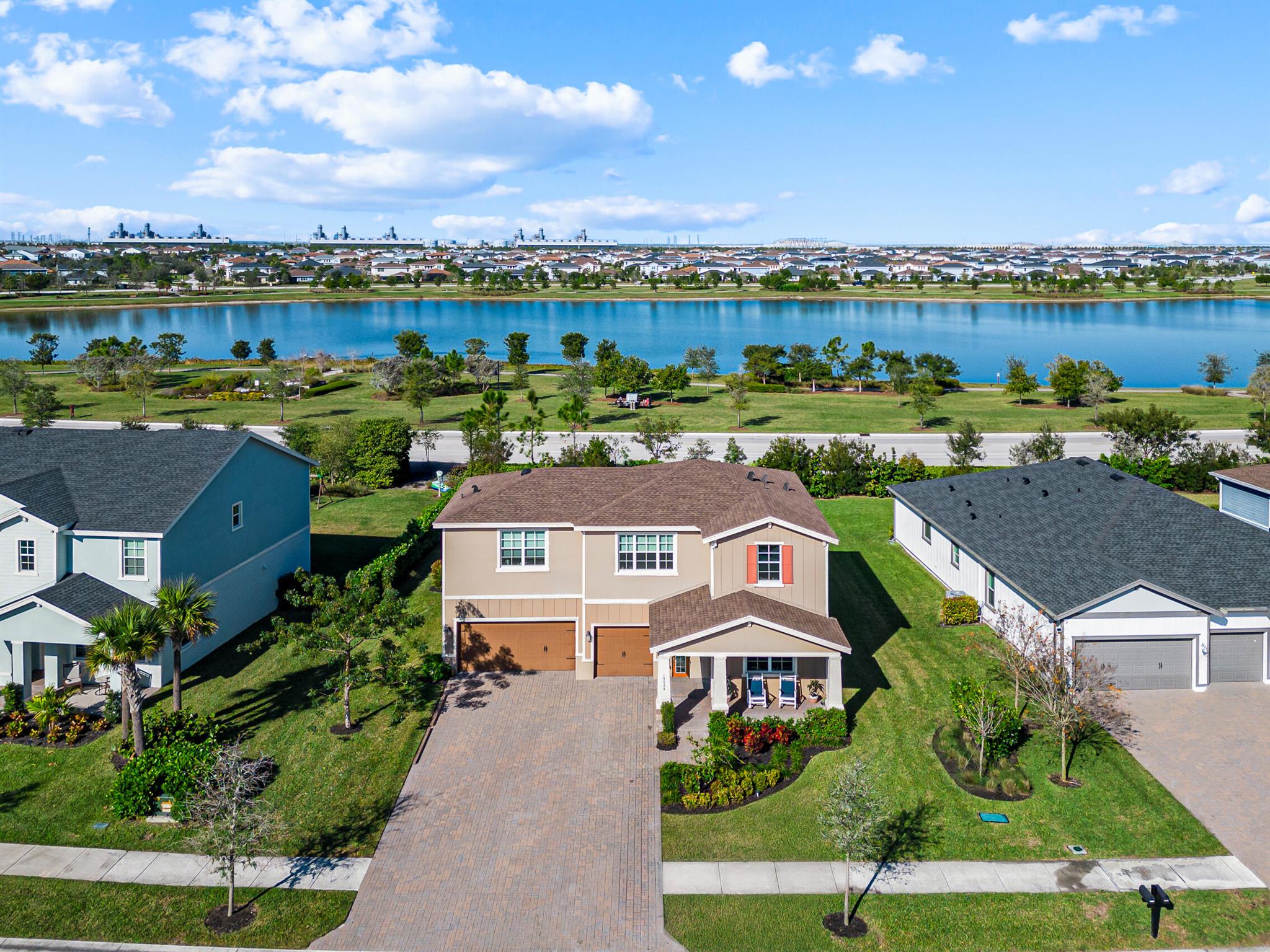 Lake walkers and runners this is your DREAM home! Located in the highly sought after master community Arden. This waterfront home offers 5 bedrooms with the owners suite on the 1st floor along with a flex room while 4 spare bedrooms upstairs share a loft and 2 full baths.This home is great for entertaining or multi-generational families with 3,338 sqft of living space, an over sized 3 car garage and a driveway that holds 9 cars! The backyard is large enough for a pool and outdoor kitchen.The sunsets are literally in your backyard.The amenities include a 5 acre working farm,resort style pools, spa and splash pad, tennis and basketball courts, pickleball, soccer fields, playgrounds and a new skate park opening soon. Saddle View elementary opens this August for the 2025/2026 school year