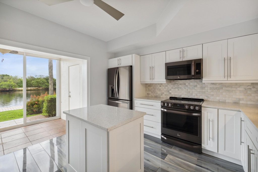 Photo of 1075 Kokomo Key Lane, Delray Beach, FL 33483 (MLS # R10966634)