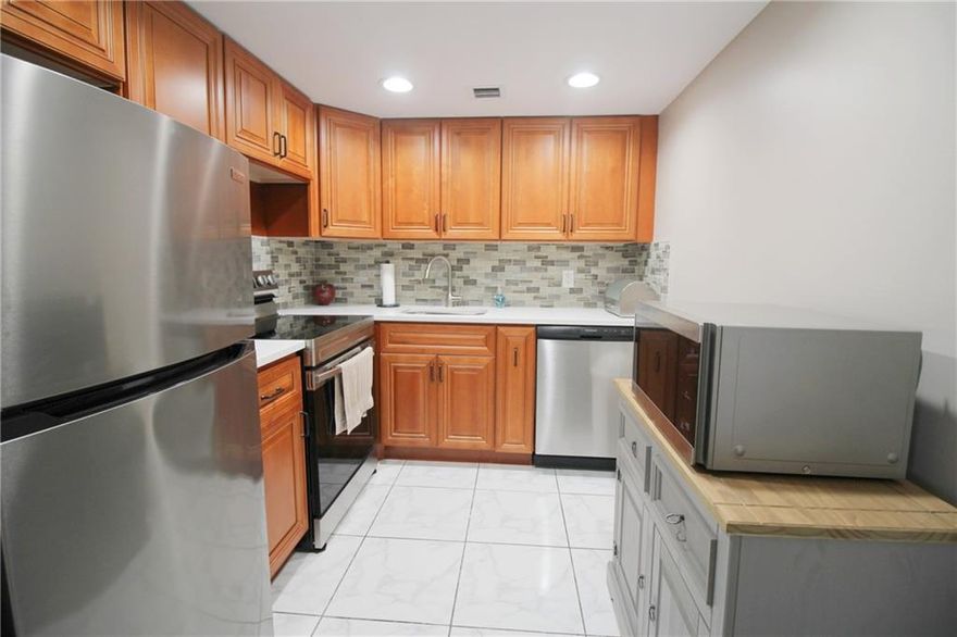 JUST REDUCED!!!! BEAUTIFULLY UPDATED 2 BEDROOM, 1.5 BATH READY TO MOVE RIGHT IN! THIS 4TH FLR CONDO FEATURES A GORGEOUS KITCHEN W/ NEW STAINLESS STEEL APPLIANCES, QUARTZ COUNTERTOPS & TILE BACKSPLASH! CERAMIC TILE FLRS IN KITCHEN, LIVING ROOM & DINING ROOM! QUALITY FURNISHINGS INCLUDING A LEATHER COUCH & RECLINER IN LIVING RM! REMODELED PRIMARY BATH W/ NEW VANITY, TUB & SHOWER & CERAMIC TILE FLOOR! ENJOY A CUP OF COFFEE ON THE ENCLOSED PATIO W/ SLIDING GLASS WINDOWS, AND SERENE GARDEN VIEW!! COMMUNITY COURTYARD & BBQ, TOO! WELL MAINTAINED ELEVATOR! NON RENTAL BUILDING, 650 MINIMUM CREDIT SCORE!  55+ COMMUNITY WITH FREE TRANSPORTATION INSIDE AND OUT! THE GATED COMMUNITY ALSO FEATURES A FABULOUS CLUBHOUSE W/CLASSES, CLUBS, FREE MOVIES, BROADWAY SHOWS & STATE OF THE ART GYM! ASSOC. CLAIMS 55+