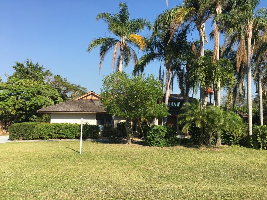 Great location in desirable Rocky Point - a peninsula surrounded by our beautiful local waterways!  Boat ramps, marinas and waterfront restaurants are all around the corner! On almost 1/2 acre of lush landscape, this pool home is over 2500 sq. ft under air with very spacious living areas and large bedrooms.  The living room has cathedral ceilings and a beautiful transom window over the front door.  Large screened pool patio with full cabana bath. The huge driveway will accommodate several cars, a boat and an RV!  No HOA!  County water and sewer. Home is sold AS IS with right to inspect. Call today to schedule your showing!