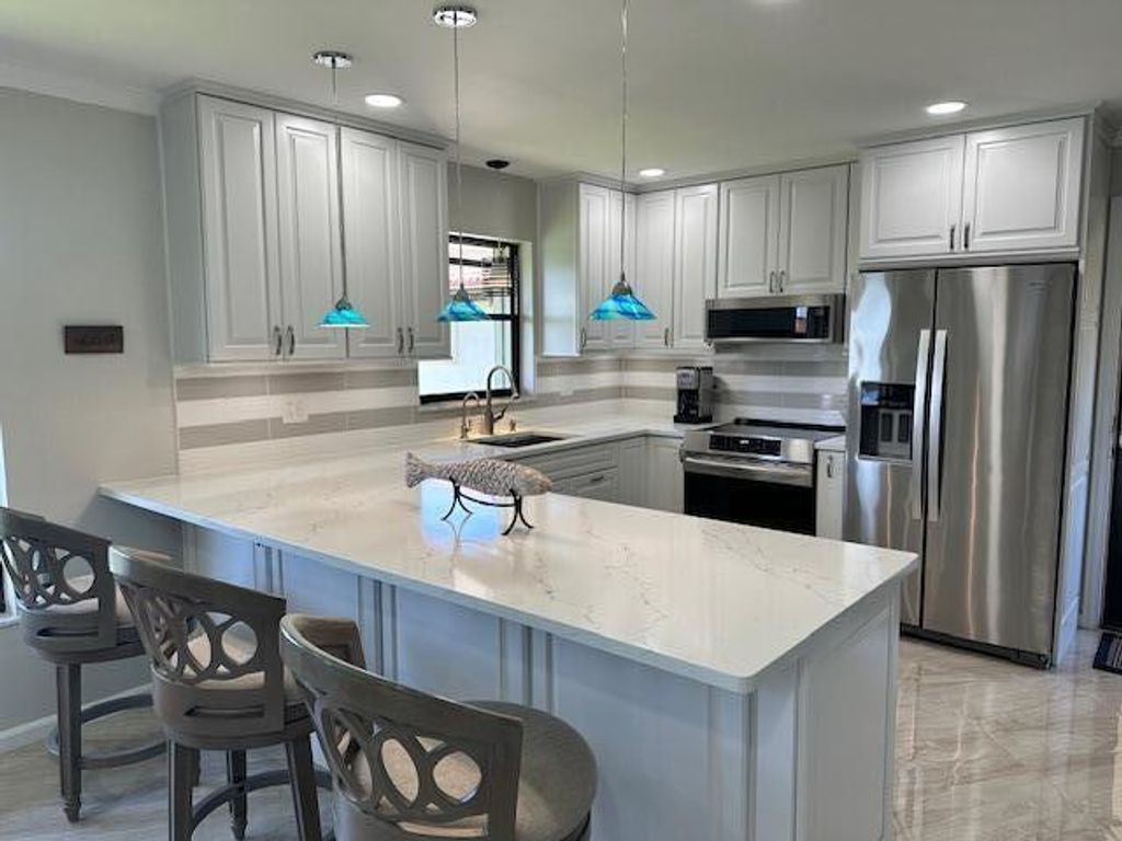 Photo of 811 SW South River Dr #206, Stuart, FL 34997 (MLS # R11034673)