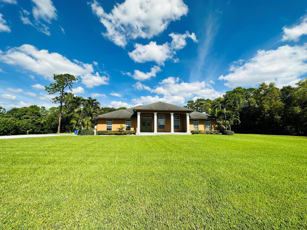 Photo of 14917 Tangelo Boulevard, West Palm Beach, FL 33412 (MLS # R10929993)