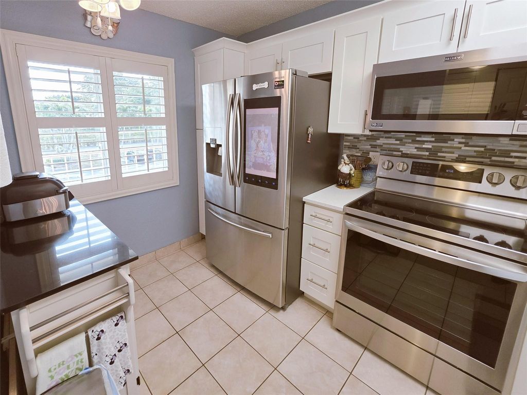 Photo of 7145 Huntington Lane #208, Delray Beach, FL 33446 (MLS # F10551514)