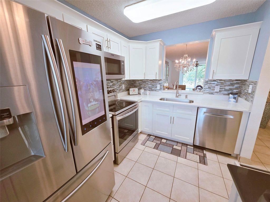 Photo of 7145 Huntington Lane #208, Delray Beach, FL 33446 (MLS # F10551514)