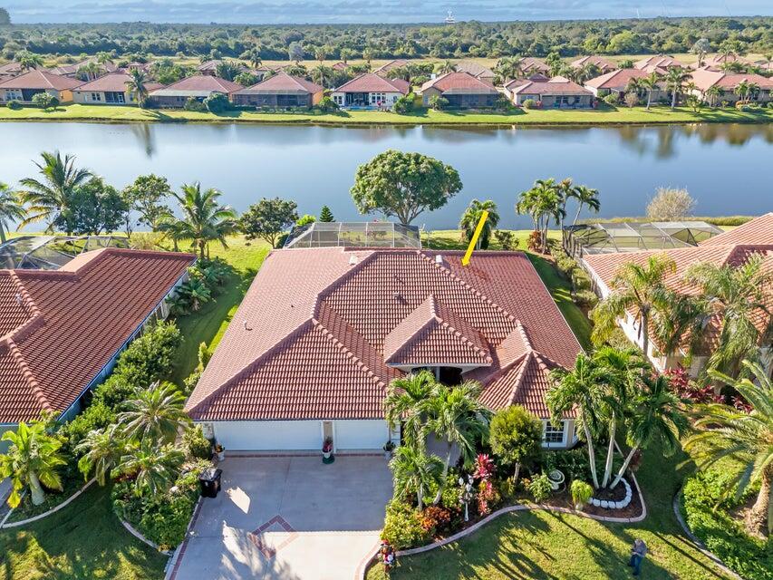 Stunning & exquisitely completely remodeled & well-appointed 3/2/2 lake view executive home with versatile use either office or den in desirable Heatherwood quaint community @ St Lucie West. Not just your average home, keen attention to detail, nicely manicured exterior with lush landscaping, nice open & flowing floor plan with upgraded tile flooring throughout., upgraded gourmet kitchen with large island with quartz countertop perfect for entertaining, a chef's delight. Formal dining, breakfast nook, formal living & cozy family room, extended porch overlooking the expansive view of the lake & majestic mature fruit trees. Oversized master suite with lake view. Great private community close to shopping, restaurants and I-95. Take a peek & fall in love. It's good to be to home! Just Lovel