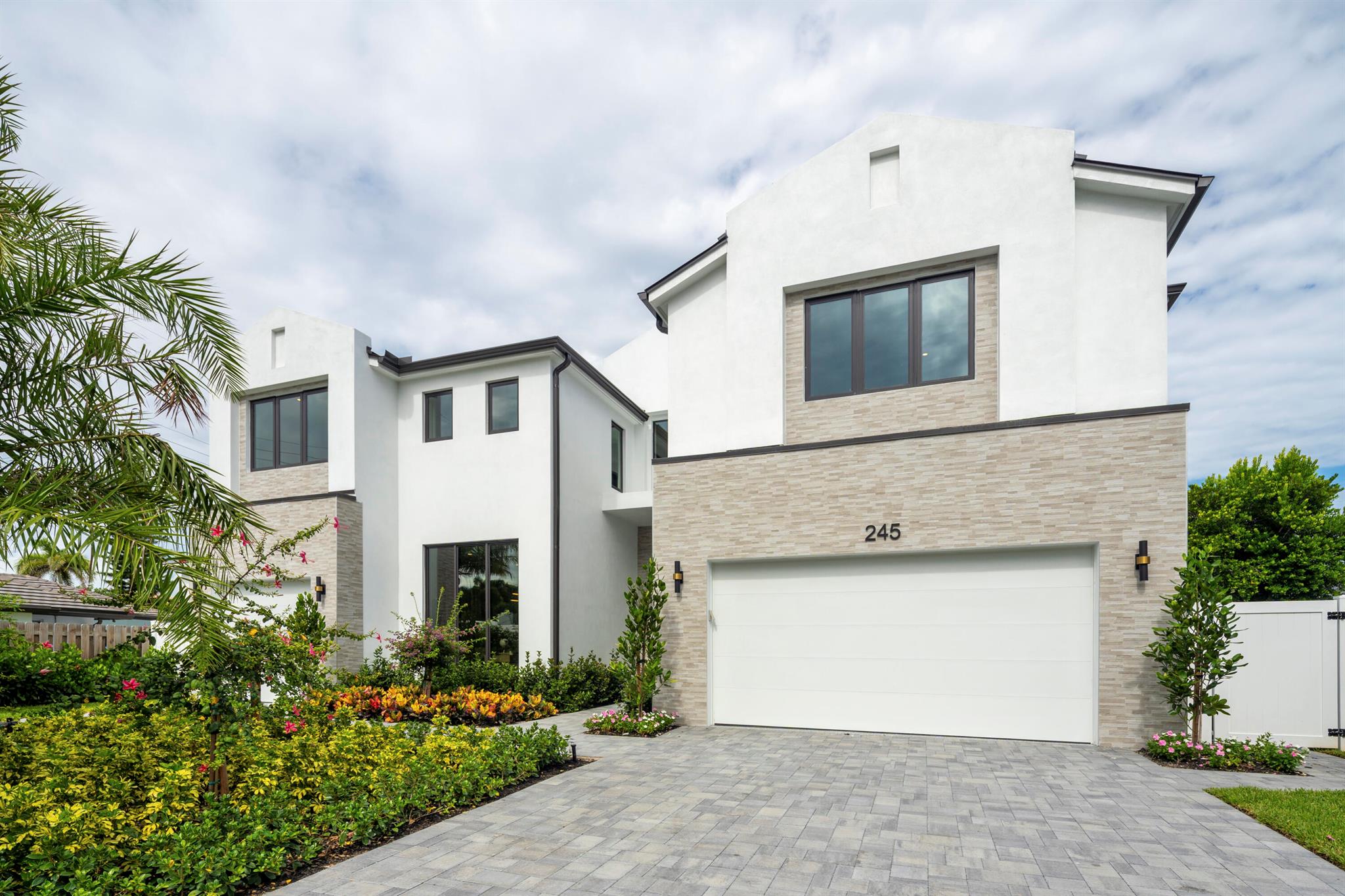 This stunning residence is a true showcase of Mizner Development's award-winning design and modern sophistication. Step inside to discover a thoughtfully designed layout featuring five ensuite bedrooms, plus a private office, stylish club room, and spacious loft. The heart of the home is a grand open-concept living area, filled with natural light and centered around a chef's dream kitchen, complete with Wolf appliances, custom cabinetry, and sleek finishes. The main level is perfectly suited for both everyday living and entertaining, with the club room, VIP guest suite, and executive office offering--flexibility and luxury. Upstairs, four private bedroom suites are thoughtfully positioned at the corners of the home, providing privacy and comfort for all.