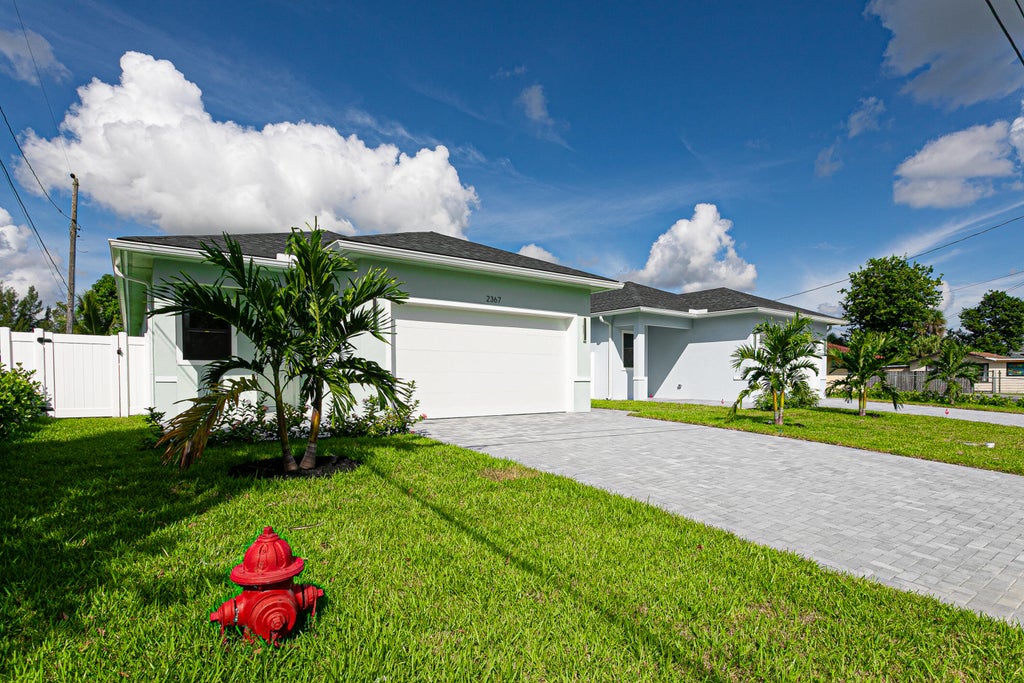 Photo of 2367 E FAITH Avenue, West Palm Beach, FL 33417 (MLS # B26086086)