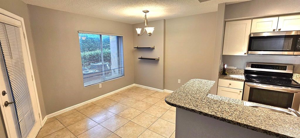 Photo of 815 W Boynton Beach Boulevard #7-105, Boynton Beach, FL 33426 (MLS # R10965114)