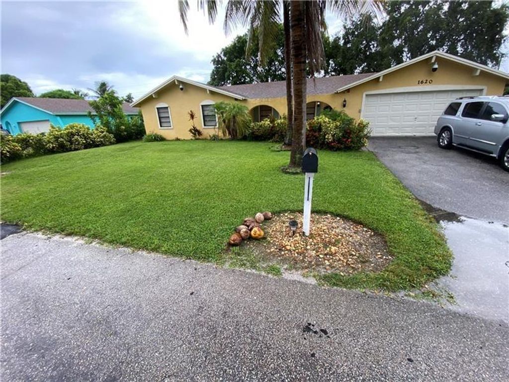 Photo of 1620 Sherwood Ave, Mangonia Park, FL 33407 (MLS # F10331356)