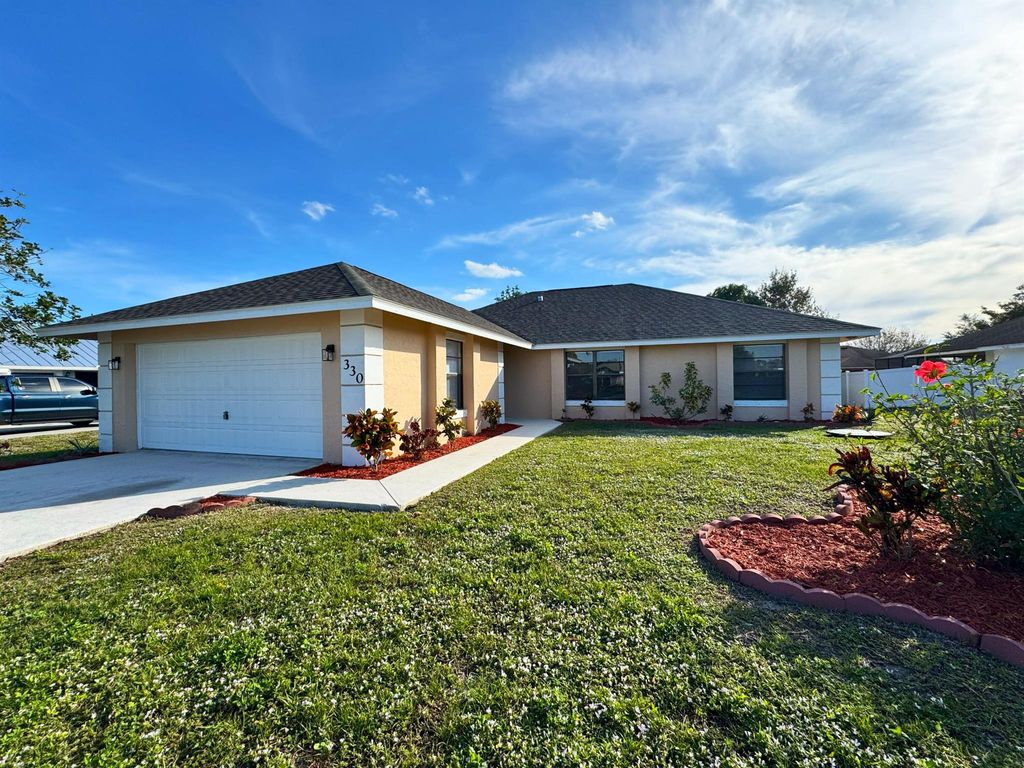 Photo of 330 SE Inwood Avenue, Port Saint Lucie, FL 34984 (MLS # R11047070)