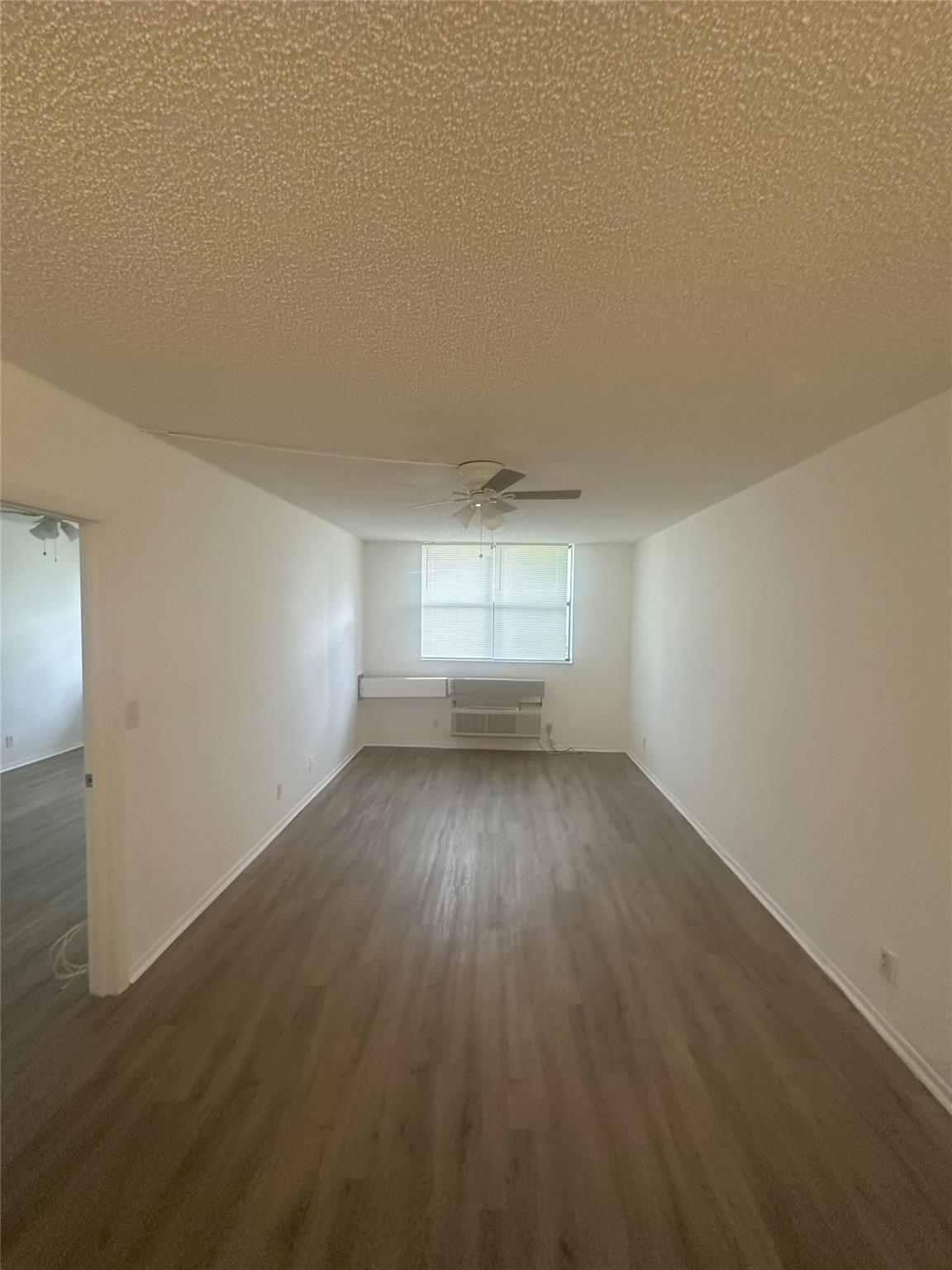 ONE OF THE LOWEST PRICES IN CORAL SPRINGS! 5th floor, largest 1-bed/1-bath condo with vinyl plank flooring. Fresh paint, new bath vanity, ceiling fans, blinds & more. Open kitchen pass-thru to dining/living. Ample closets including walk-in. Newer AC (warranty thru 2027). Newer water heater. Well-maintained, move-in ready.
One assigned parking space and plenty of guest parking. This all-ages community includes: pool, hot tub, picnic area, secure-entry lobby, elevator, & laundry facilities. Maintenance includes: lawn/landscaping, common areas, elevator, laundry, trash removal and water & sewer. Close to shopping, restaurants & transportation. Priced to sell AS-IS. Lease right away. Rents for $1500+/mo. GREAT INVESTOR BUY!