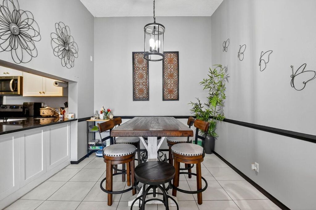 Photo of 719 Sunny Pine Way #C3, Greenacres, FL 33415 (MLS # R11115186)