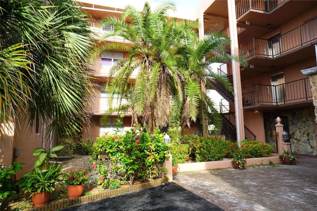 Photo of 2821 Somerset Dr #203, Lauderdale Lakes, FL 33311 (MLS # F10531246)