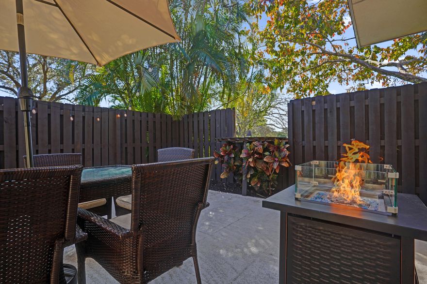 Welcome to one of the most desirable lakefront townhomes in Delray Beach. This beautifully updated two bedroom, two and a half bath residence offers one of the best water views in the entire community, with a massive private patio overlooking the lake that creates the perfect setting for relaxing evenings, outdoor dining, or entertaining friends while enjoying peaceful waterfront scenery. Inside, the home is filled with natural light from the welcoming front entry and thoughtfully designed layout. The living room features a striking custom stacked stone wall with LED accent lighting surrounding the television area, creating a warm and modern focal point. The renovated white kitchen is both stylish and functional with quartz countertops, stainless steel appliances, and an open layout that that flows seamlessly into the living and dining areas. Upstairs, the spacious primary suite includes a private balcony overlooking the water, a custom closet, and a beautifully updated bathroom with a brand new vanity and gorgeous tile work. The second bedroom is exceptionally large with generous closet space and plenty of natural light, making it perfect for guests, family, or a home office. Additional highlights include all impact windows and doors throughout, a full size washer and dryer, modern bathrooms, and a convenient entry space for shoes and everyday storage. The roof was recently resealed by the HOA, providing added peace of mind. The property can be rented immediately and pets are welcome, making it a fantastic option for both homeowners and investors. Located in the heart of Delray Beach, you are just minutes from Atlantic Avenue's restaurants, shopping, and nightlife, approximately eight minutes to the beach, and close to Whole Foods, Trader Joe's, fitness studios, yoga classes, and everyday conveniences. The community sits near I 95 for easy commuting yet far enough away that you do not hear highway noise, and it is just moments from the Boca Raton border, giving you quick access to the best of both cities. Homes with lake views like this rarely become available, making this a unique opportunity to enjoy the best of the Delray Beach lifestyle.