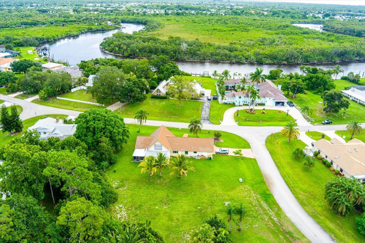 Discover the perfect opportunity to build your dream home in the highly sought-after Hidden River Estates, a secluded and serene community nestled along the North Fork of the St. Lucie River. This oversized .36-acre lot offers a deeded dock and ample space and privacy, ideal for creating a custom retreat surrounded by nature. Enjoy direct access to the water with your deeded dock, perfect for boating, fishing, or simply taking in the scenic river views. Hidden River Estates is a hidden gem, offering a tranquil lifestyle while still being conveniently located near shopping, dining, and major highways. Don't miss your chance to own a slice of paradise in this exclusive waterfront neighborhood.