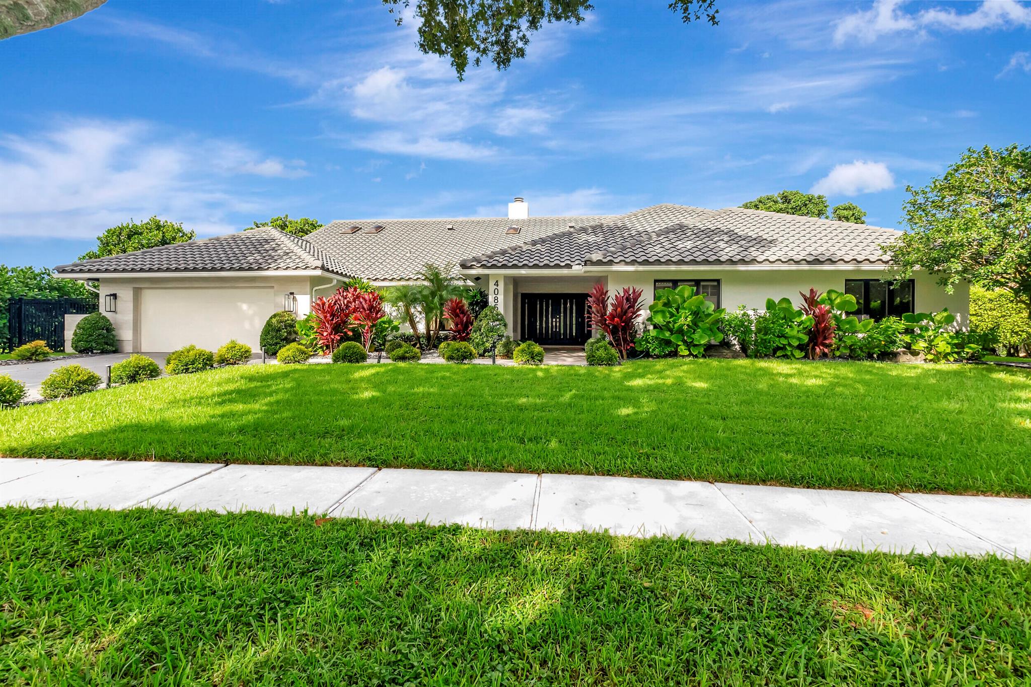 Impeccably designed, this 5 BR/4.5 BA home was entirely renovated within the past year. Furniture negotiable.The primary suite is a sanctuary, with hardwood floors, a Florida Room, a massive walk-in closet, & a bathroom that exudes tranquility.The kitchen is a chef's dream, featuring full-sized, side-by-side refrigerator & freezer, double ovens, double sinks, gas stove, & ice maker. Whether you're hosting or simply enjoying a quiet meal, this kitchen is equipped to handle it all.In addition to the 4 bedrooms, there is another room with ensuite bath & built-in closets- perfect for a media room or private guest room.The incredible backyard features both a screened in patio & yard space; a full wet bar; a sports court; and a completely redone & resurfaced heated pool & spa.