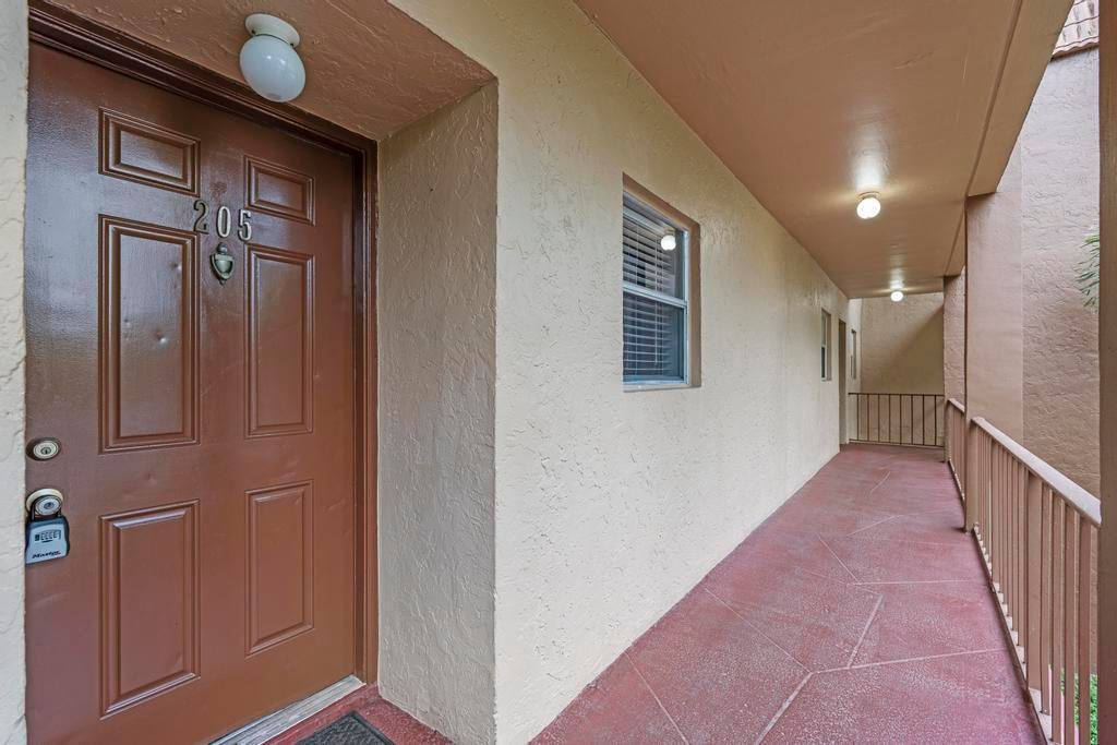 Photo of 120 Sparrow Drive #205, Royal Palm Beach, FL 33411 (MLS # B26010231)