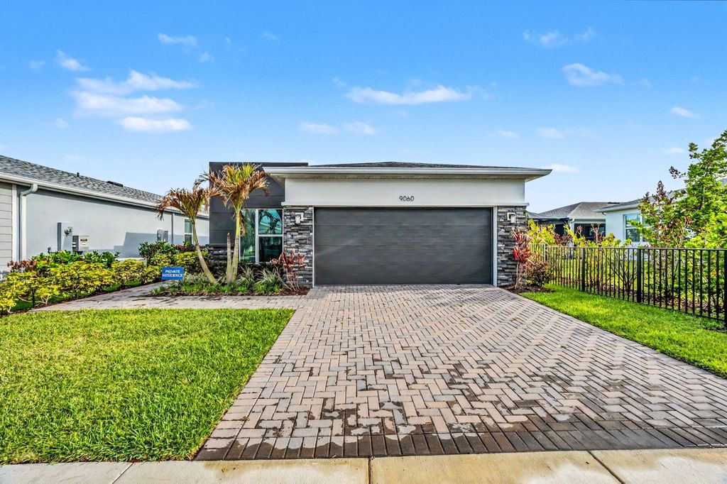 Photo of 9060 SW Remy Lane, Port Saint Lucie, FL 34987 (MLS # B26012999)