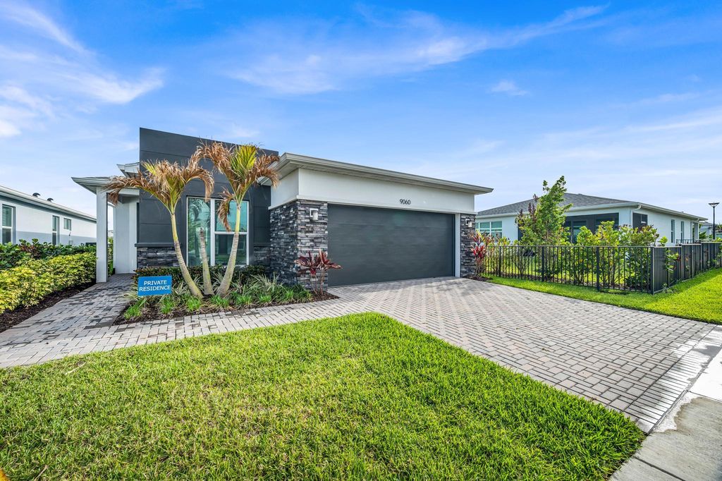 Photo of 9060 SW Remy Lane, Port Saint Lucie, FL 34987 (MLS # B26012999)