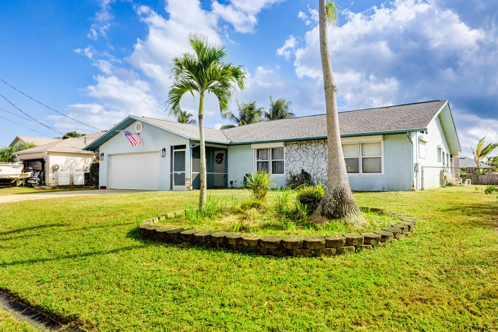 Photo of 582 SW Carter Avenue, Port Saint Lucie, FL 34983 (MLS # R10956596)