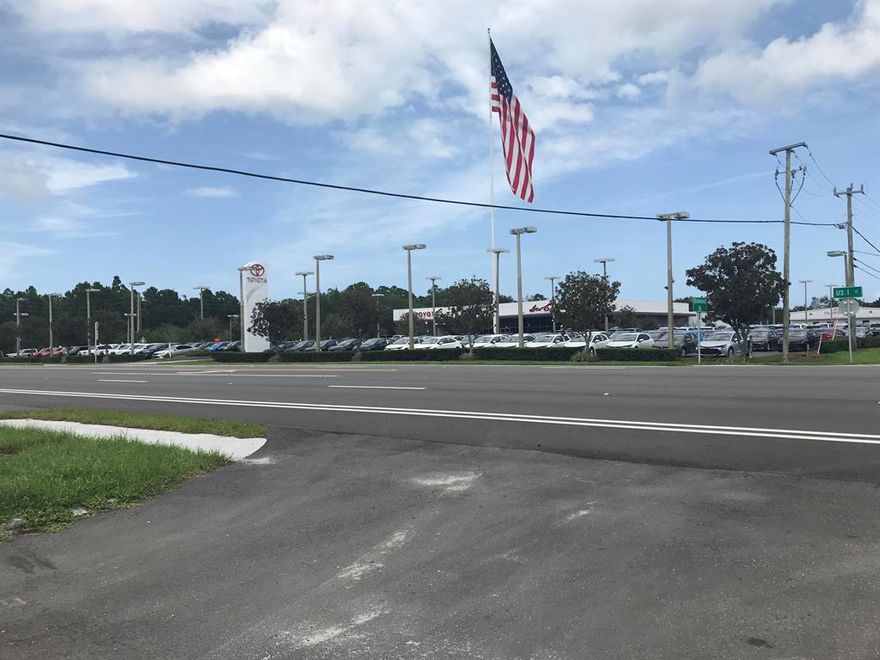 1.35 AC with a small building which includes an office and restroom.  The land is fenced with barbed wire.