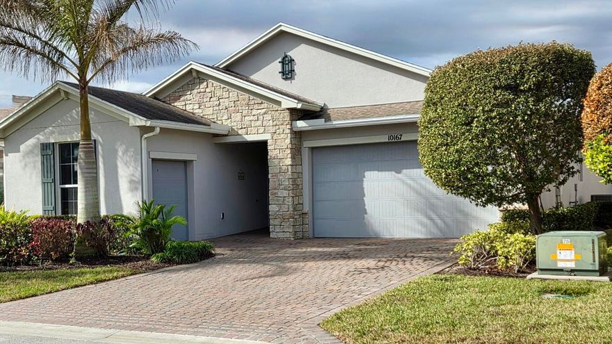 This beautiful CBS construction home was purchased as an investment home and has never been lived in full-time. It features durable impact glass windows and elegant upgraded flooring throughout. The open-concept layout showcases seamless indoor-outdoor living. Tasteful plantation blinds complement the 2 bedroom, 1 den, 2 bath home and master closet has a custom, California finish. Home has a 2 car garage and separate golf cart garage and backyard is a tranquil retreat with natural privacy screening. 

Buyer to pay ONE-TIME fees for Vitalia Cap Contribution of $2200.00 and Tradition Community Enhancement Fee equal of .97% of the sale price. The HOA provides an extensive range of amenities including cable, high-speed internet, security alarm system, meticulous lawn care, a modern fitness center, tennis and pickleball courts, a sparkling pool, and much more. Conveniently located near Cleveland Clinic, vibrant Tradition Square shopping and dining, and just about 35 minutes to the pristine beach.