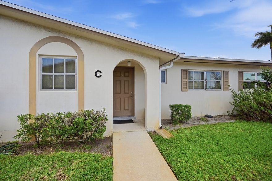 Welcome home to this beautifully updated 2-bedroom, 2-bathroom furnished villa located in a desirable 55+ community just minutes from Lake Worth Beach. This light and bright home offers a comfortable, open layout with a screened patio—perfect for enjoying the South Florida lifestyle. The upgraded kitchen is designed for both style and function, featuring modern cabinetry, quartz countertops, and a sleek tile backsplash. Throughout the home, you'll find durable laminate flooring (no carpet) and thoughtfully designed custom closets. Both the primary and guest bathrooms have been tastefully renovated with contemporary frameless glass showers. Convenience is key with community laundry just steps away, and you're only a short 3-minute walk to the clubhouse.  Residents enjoy a wide range of amenities including a pool, fitness center, billiards room, card room, coffee lounge, library, shuffleboard, and bocce ball courts. Community requirements include at least one occupant age 55+, with the second occupant being 21+. A minimum credit score of 700 is required. No pets permitted.