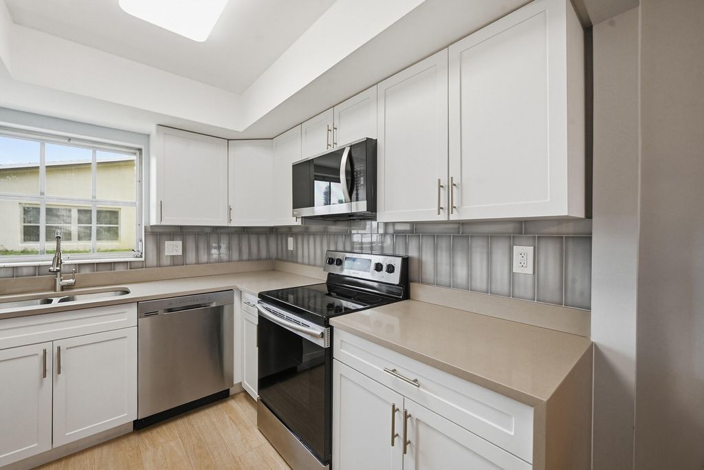 Photo of 2680 Barkley Drive E #C, West Palm Beach, FL 33415 (MLS # B26022098)