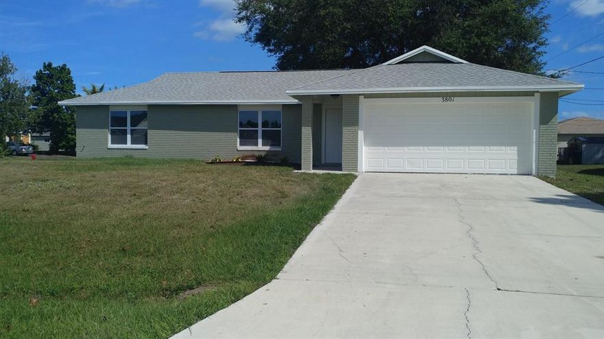 Beautifully remodeled single family ranch home featuring a brand NEW ROOF, NEW IMPACT WINDOWS, NEW HOT WATER HEATER, NEW A/C, NEW STAINLESS APPLIANCES, new tile floors and baseboards, newly remodeled bathrooms and kitchen, Fresh Paint inside and out.  The home is connected to city water and sewer.