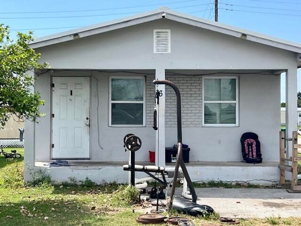 Photo of 625 Amaryllis Avenue, Pahokee, FL 33476 (MLS # R10969347)