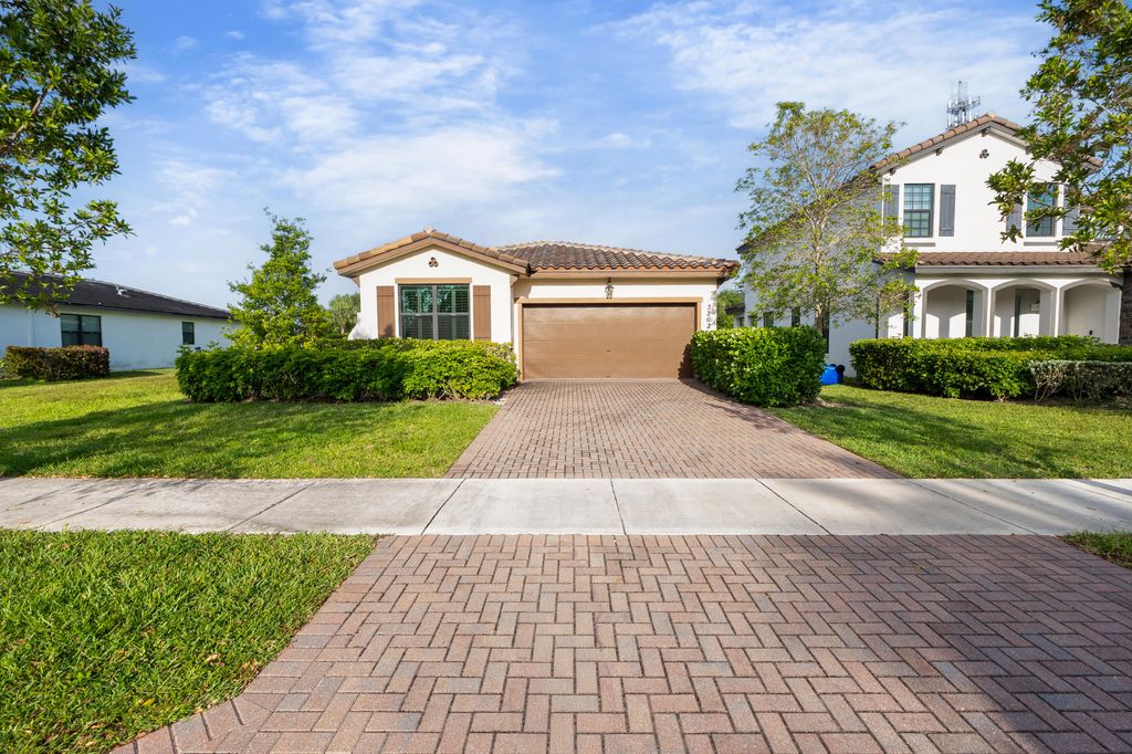 Photo of 3263 Dunning Drive, Royal Palm Beach, FL 33411 (MLS # B26015618)